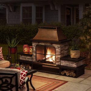 sunjoy atticus outdoor fireplace with chimney nighttime